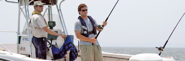 Two Men On Boat Fishing