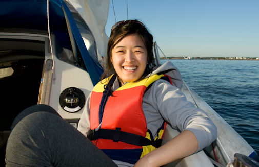 Woman On Boat Wearing PFD